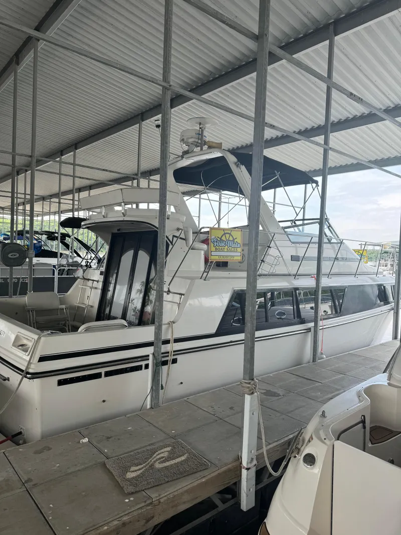 Slide: The Image of 1986 Carver 36 Mariner docked in a covered marina. - 5