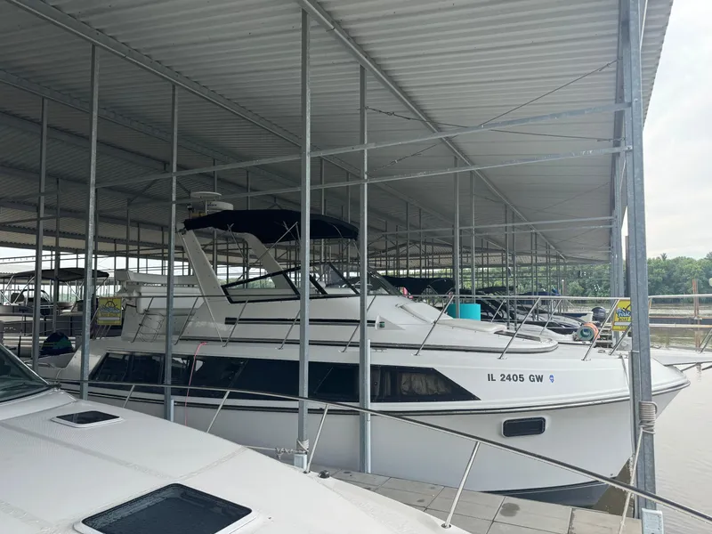 Slide: The Image of 1986 Carver 36 Mariner docked in a covered marina. - 6