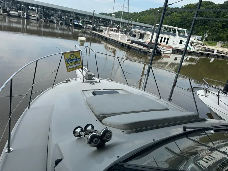 Slide: The Image of 1986 Carver 36 Mariner at marina dock, listed for sale by First Mate Boat Sales. - 9