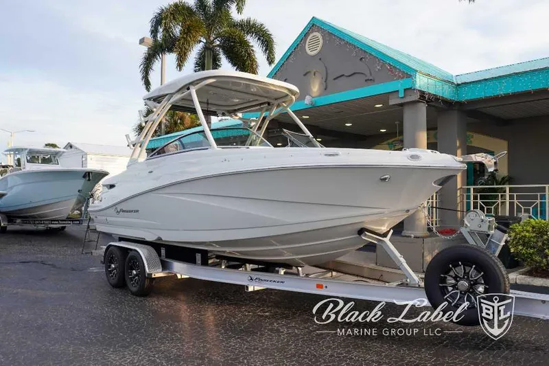 The Image of 2024 Finseeker 240 DC boat on trailer at Black Label Marine Group dealership. - 0