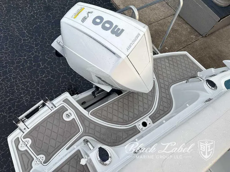 Slide: The Image of 2024 Finseeker 240 DC boat with Mercury outboard motor, rear deck view. - 14
