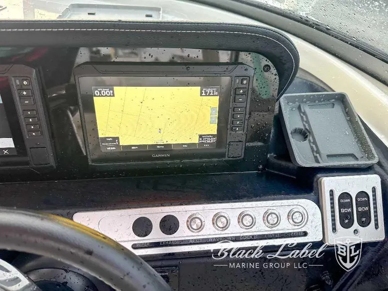 Slide: The Image of 2024 Finseeker 240 DC boat dashboard with Garmin navigation system and control panel. - 8