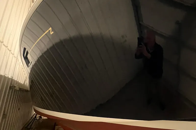 Slide: The Image of 2013 MJM 40z Downeast boat in storage, reflecting light. - 14