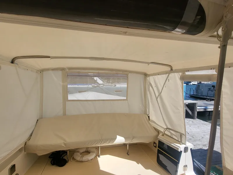 Slide: The Image of 2013 MJM 40z Downeast boat interior with covered seating area. - 22