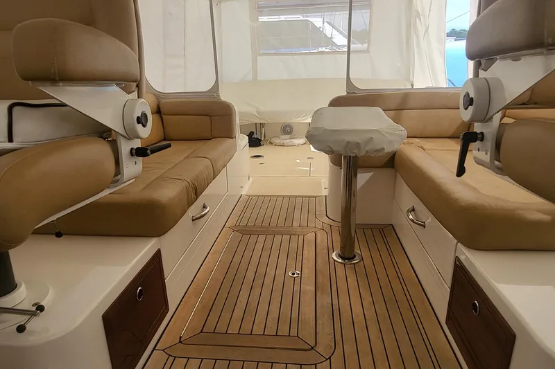 Slide: The Image of 2013 MJM 40z Downeast yacht interior with tan seating and wooden flooring. - 24