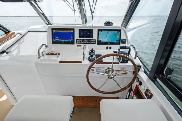 Slide: The Image of Luxurious 2013 MJM 40z yacht helm with plush seating and advanced navigation system. - 35