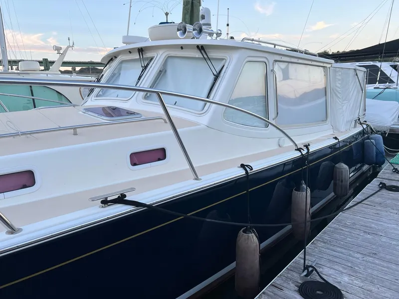 Slide: The Image of 2013 MJM 40z Downeast boat docked at marina with fenders. - 6