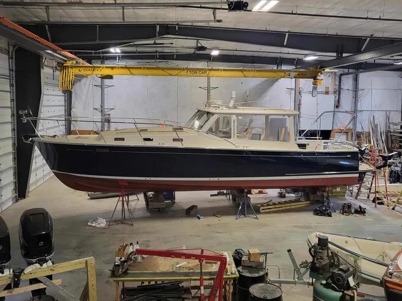 Slide: The Image of 2013 MJM 40z Downeast boat in a workshop for maintenance. - 7