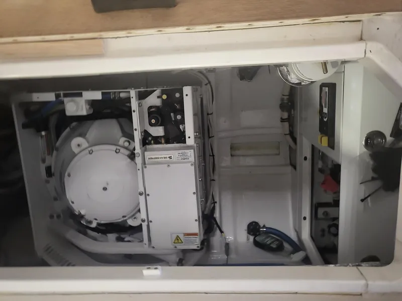 Slide: The Image of Engine compartment of 2013 MJM 40z Downeast boat, showcasing mechanical components. - 29