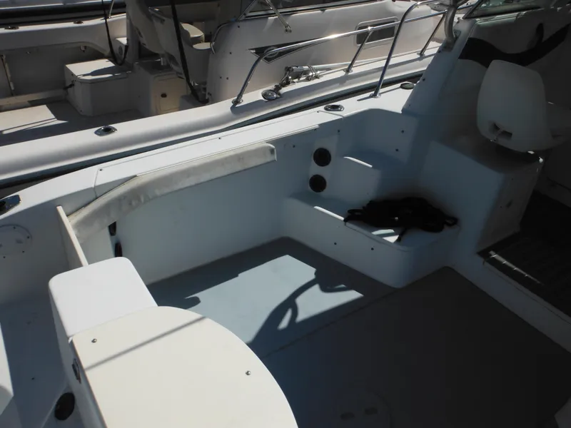 Slide: The Image of 2000 Seaswirl 2300 Walk Around boat interior, spacious seating and storage. - 10