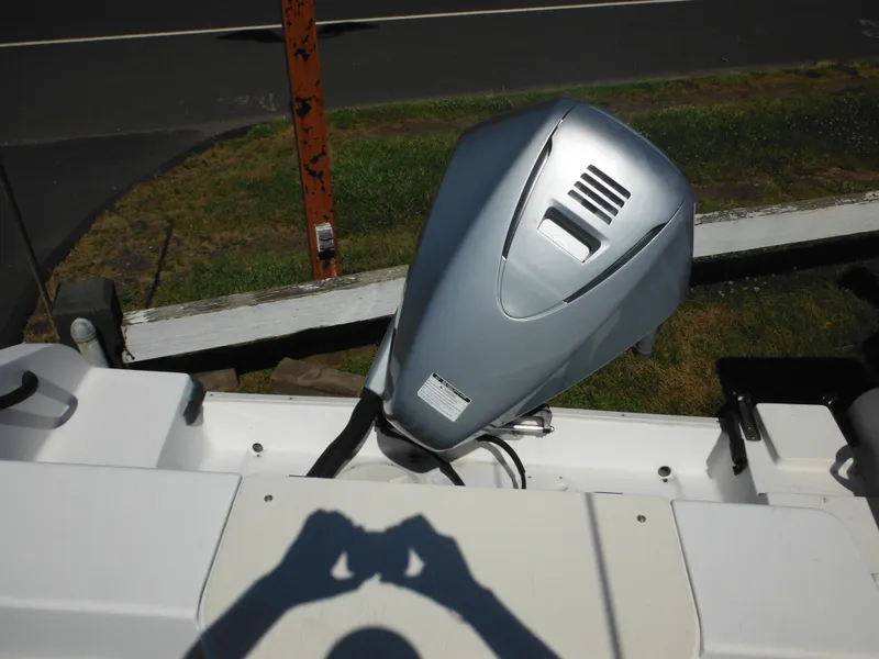 Slide: The Image of 2000 Seaswirl 2300 Walk Around boat with outboard motor. - 11