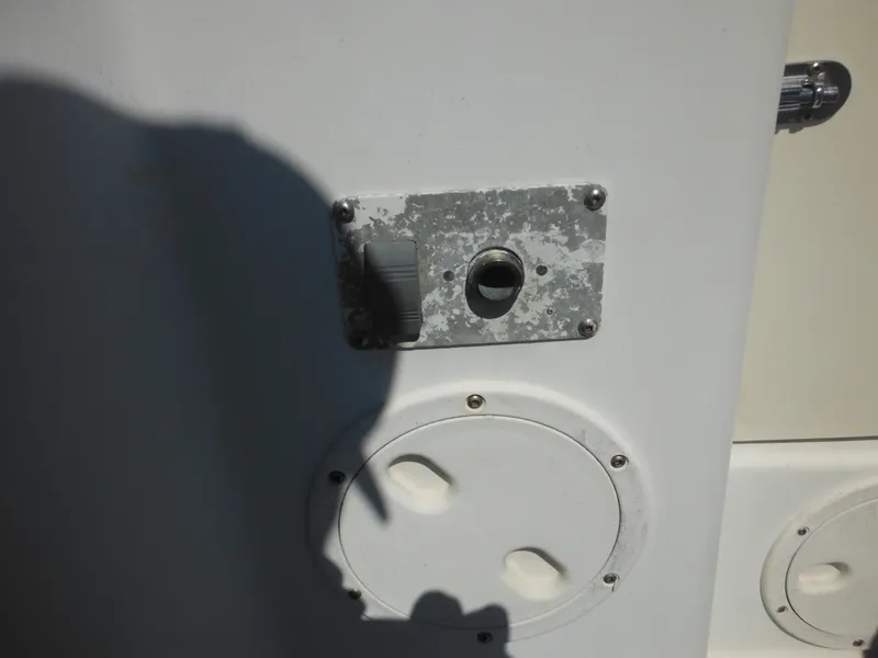 Slide: The Image of Close-up of a 2000 Seaswirl 2300 Walk Around boat's exterior hardware. - 13