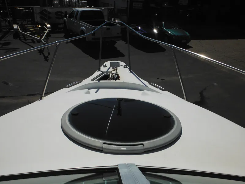Slide: The Image of 2000 Seaswirl 2300 Walk Around boat bow with hatch and railing. - 23