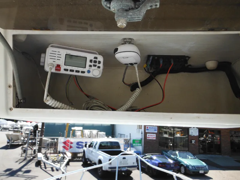 Slide: The Image of Electronics compartment of a 2000 Seaswirl 2300 Walk Around boat with radio and wiring. - 27