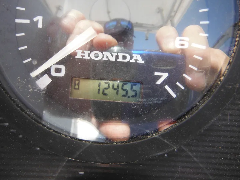Slide: The Image of Honda engine hour meter reading 1245.5 on a 2000 Seaswirl 2300 Walk Around boat. - 28