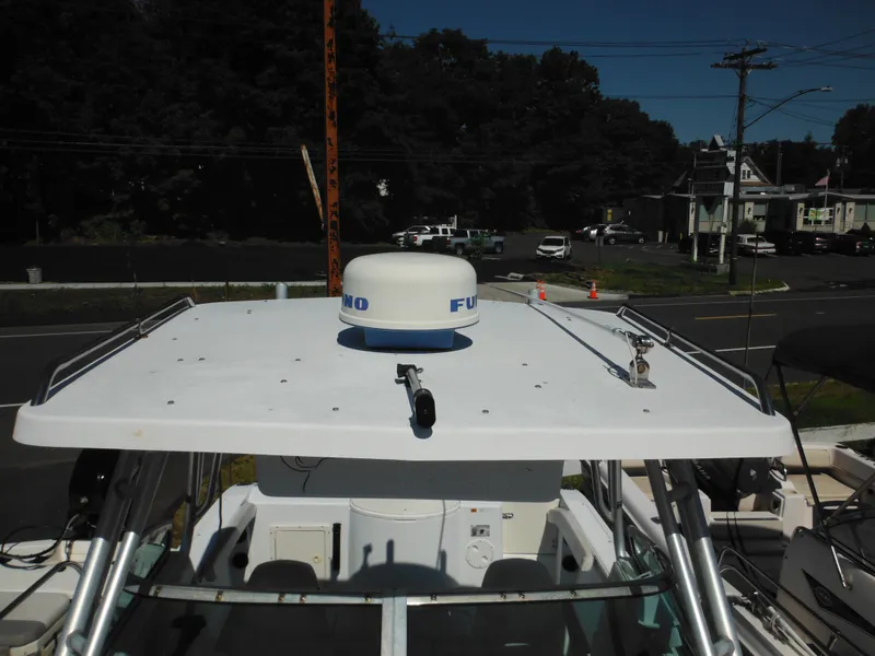 Slide: The Image of Seaswirl 2300 Walk Around 2000 model boat with radar equipment on top. - 32