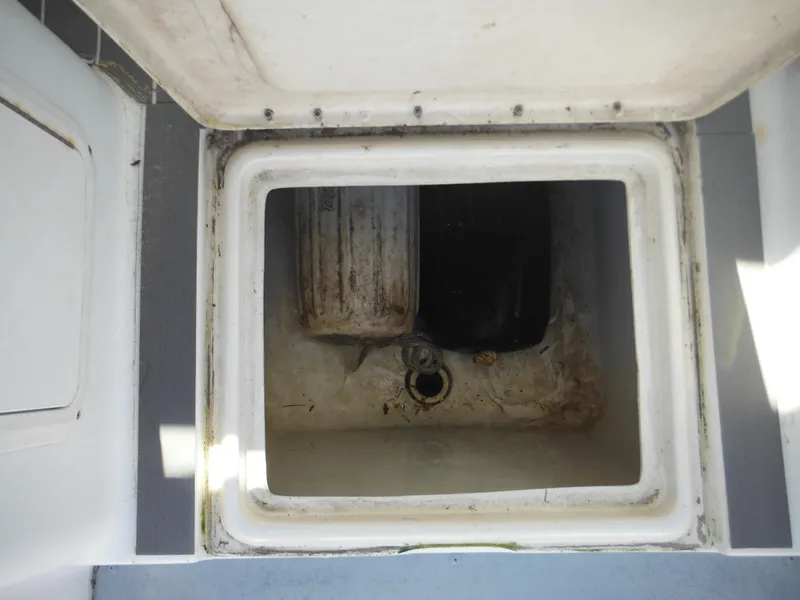 Slide: The Image of Open storage compartment on a 2000 Seaswirl 2300 Walk Around boat. - 34