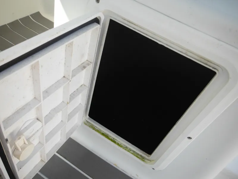 Slide: The Image of Open storage compartment on a 2000 Seaswirl 2300 Walk Around boat. - 35