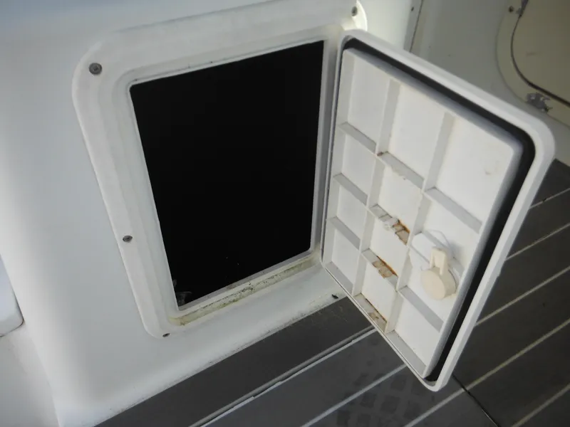 Slide: The Image of Open storage compartment on a 2000 Seaswirl 2300 Walk Around boat. - 36