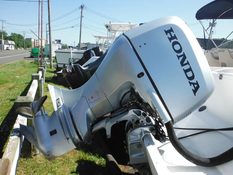 Slide: The Image of 2000 Seaswirl 2300 Walk Around with Honda outboard motor. - 4