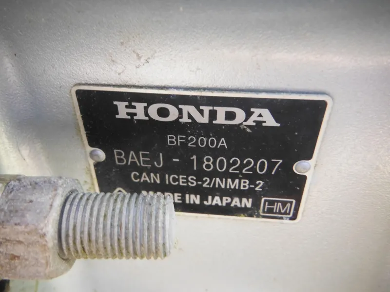 Slide: The Image of Honda BF200A engine label on 2000 Seaswirl 2300 Walk Around boat. - 8