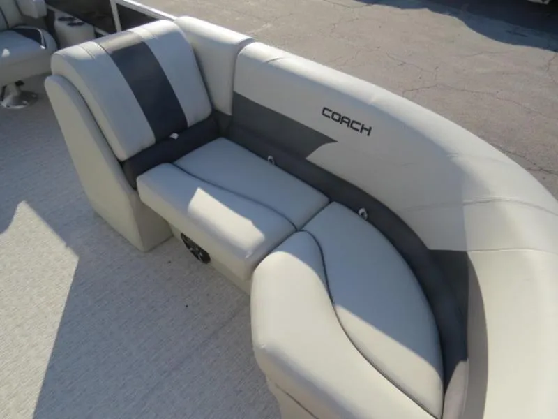Slide: The Image of 2023 Coach Pontoons 243 RFC boat interior seating with gray and white upholstery. - 15