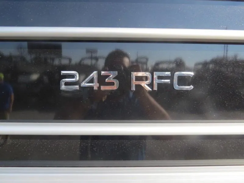 Slide: The Image of 2023 Coach Pontoons 243 RFC model emblem on boat exterior. - 3