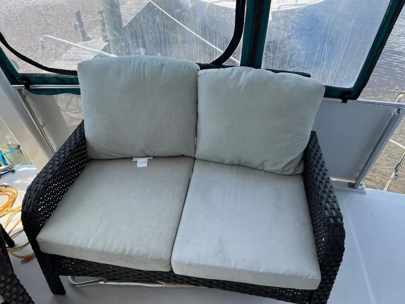 Slide: The Image of Outdoor seating on the deck of a 1994 Carver 355 Aft Cabin yacht. - 10