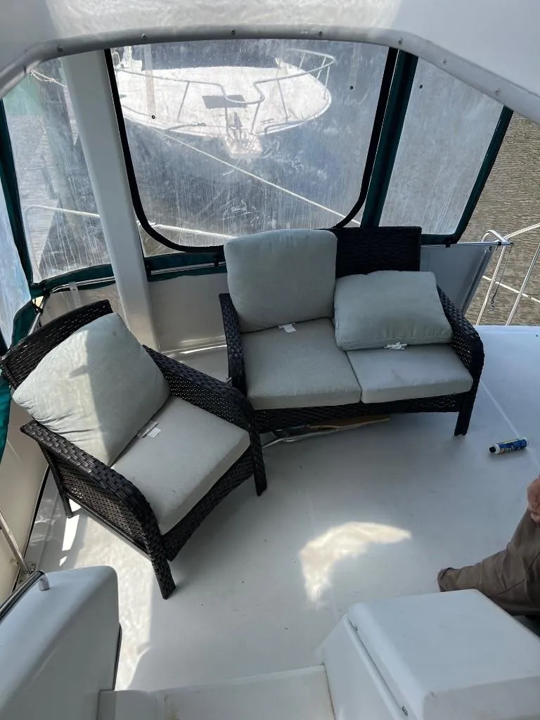 Slide: The Image of 1994 Carver 355 Aft Cabin boat interior with cushioned seating. - 7