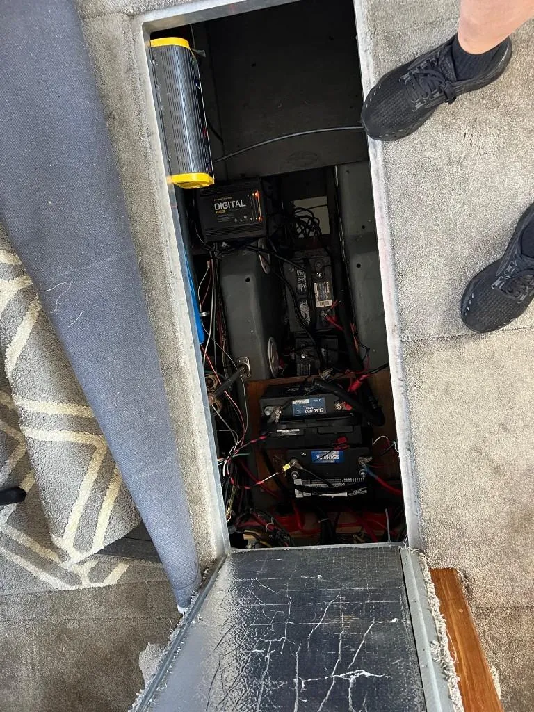 Slide: The Image of 1994 Carver 355 Aft Cabin battery compartment with wiring and equipment. - 26