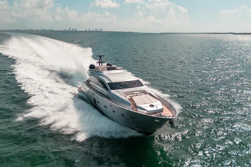 Slide: The Image of Luxurious 2012 Pershing 92 yacht cruising on open water. - 13