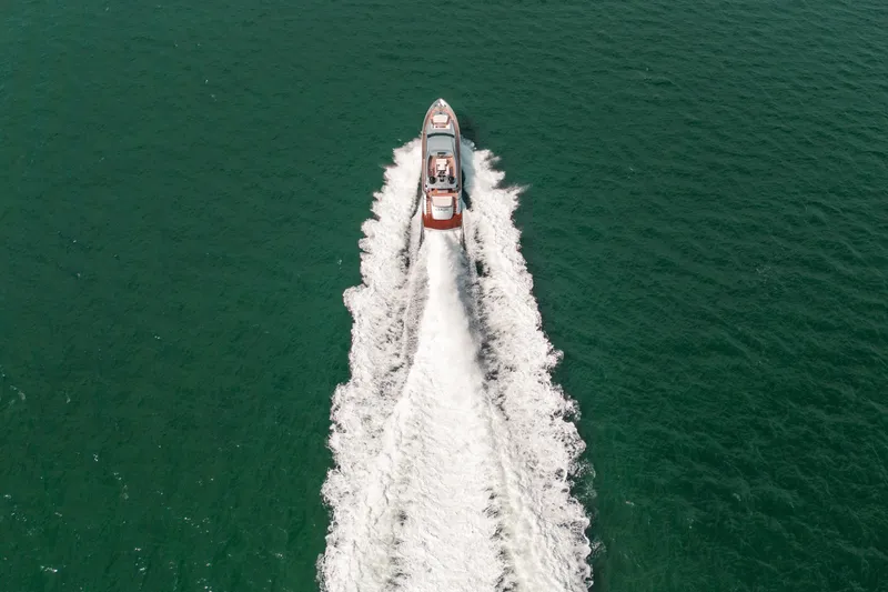 Slide: The Image of Aerial view of 2012 Pershing 92 yacht cruising on open water. - 14