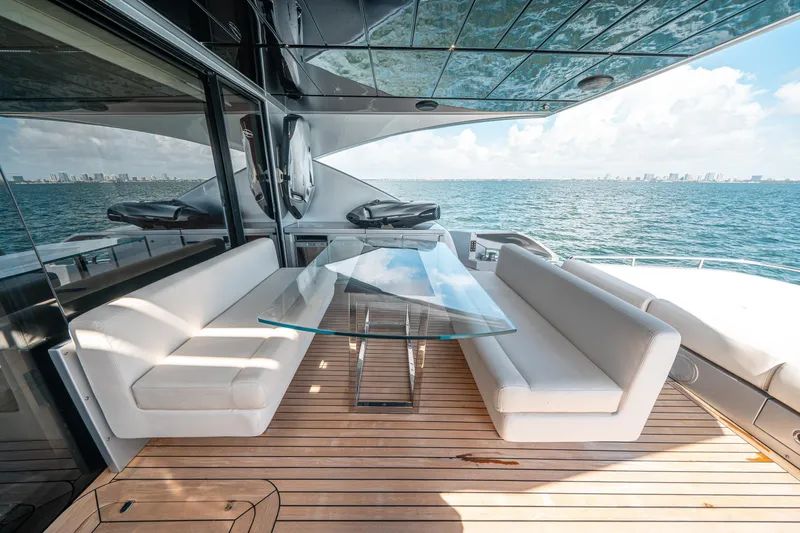 Slide: The Image of Luxury outdoor seating area on 2012 Pershing 92 yacht with ocean view. - 23
