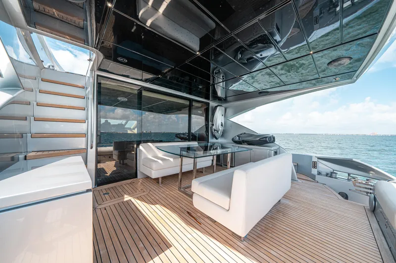 Slide: The Image of Luxurious 2012 Pershing 92 yacht deck with modern seating and ocean view. - 25
