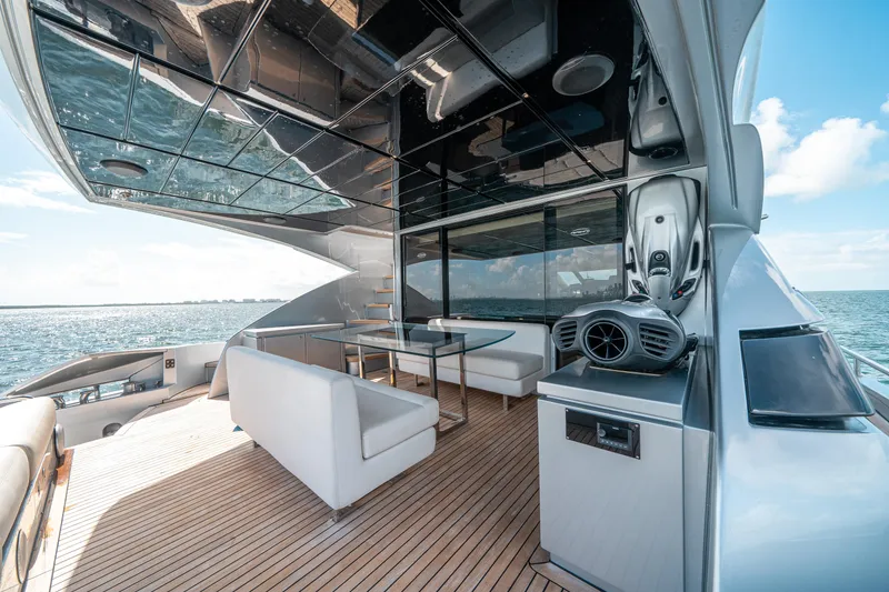 Slide: The Image of Luxurious deck of a 2012 Pershing 92 yacht with modern seating and ocean view. - 26