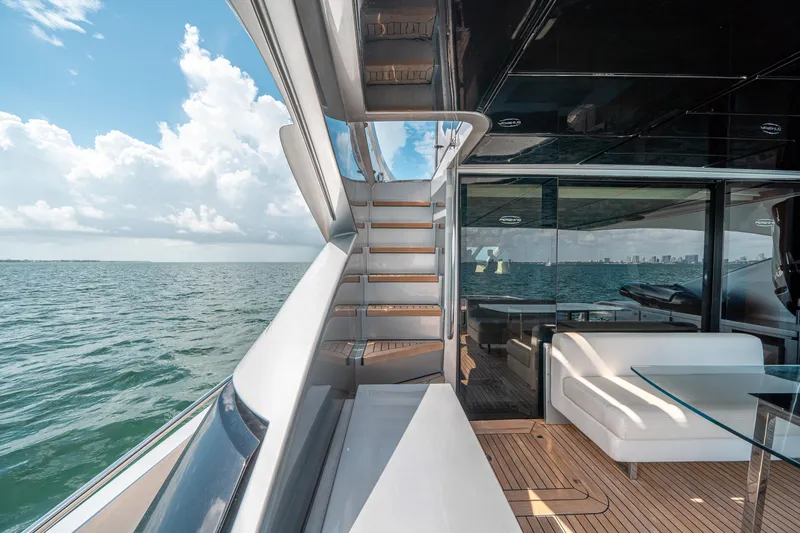 Slide: The Image of 2012 Pershing 92 yacht deck with ocean view and modern seating area. - 28