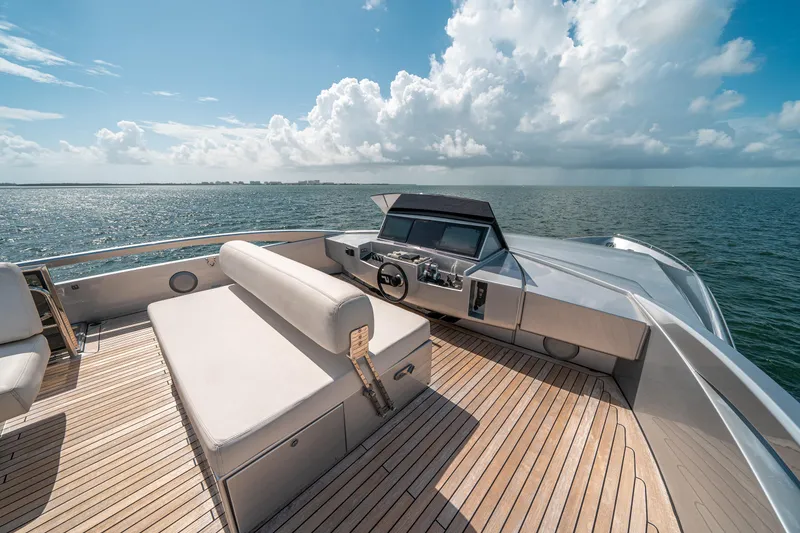 Slide: The Image of Luxury 2012 Pershing 92 yacht helm station with ocean view and clear skies. - 31