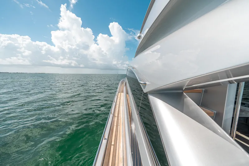 Slide: The Image of Side view of 2012 Pershing 92 yacht on open water. - 33