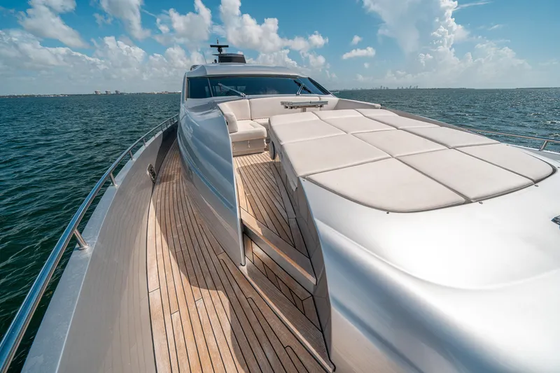 Slide: The Image of Luxurious 2012 Pershing 92 yacht with sleek design and spacious deck on open water. - 34