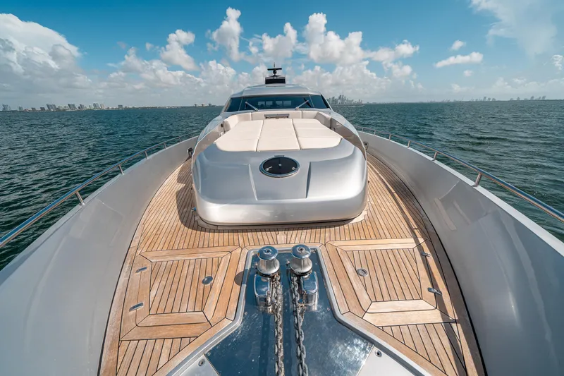 Slide: The Image of Luxurious 2012 Pershing 92 yacht with spacious deck and sunbeds on open water. - 35