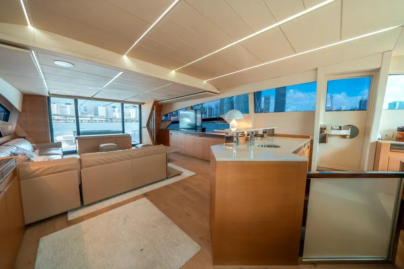 Slide: The Image of Luxurious interior of a 2012 Pershing 92 yacht with modern furnishings and panoramic windows. - 45
