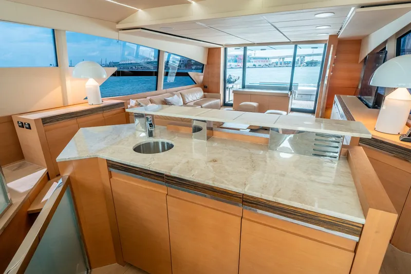 Slide: The Image of Luxurious interior of 2012 Pershing 92 yacht with modern kitchen and spacious seating area. - 46