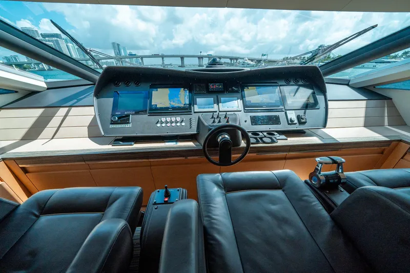 Slide: The Image of Cockpit of 2012 Pershing 92 yacht with modern navigation equipment and leather seats. - 48