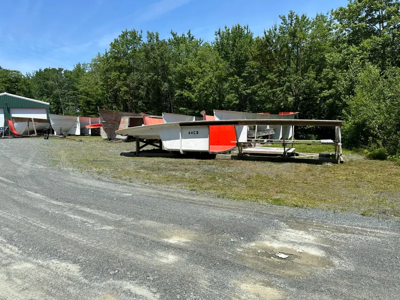 Slide: The Image of Outdoor display of Young Brothers 2020 Hull Molds on grassy area with trees in background. - 14