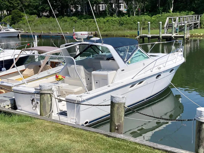 Slide: The Image of 2002 Tiara Yachts 3100 Open docked in a serene marina. - 1