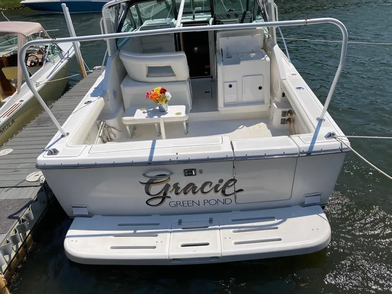 Slide: The Image of 2002 Tiara Yachts 3100 Open boat docked, named Gracie Green Pond. - 2