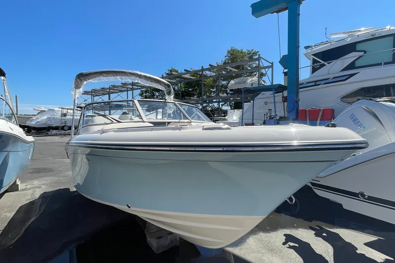 The Image of 2025 Grady-White Freedom 215 boat docked at a marina. - 0