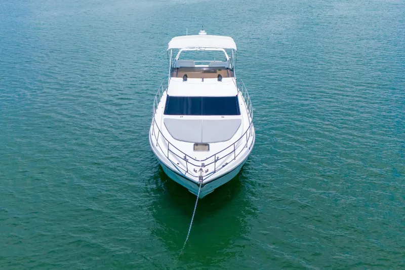 Slide: The Image of Azimut 43 Fly 1998 yacht anchored on calm water, front view. - 12