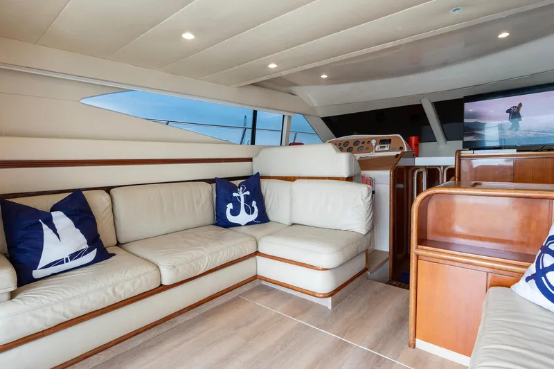 Slide: The Image of Luxurious interior of 1998 Azimut 43 Fly yacht with cream leather seating and nautical decor. - 25