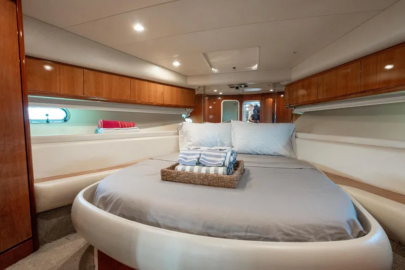Slide: The Image of Luxurious bedroom interior of 1998 Azimut 43 Fly yacht with cozy bedding. - 29